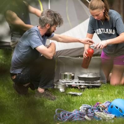 Students setting up a camp stove